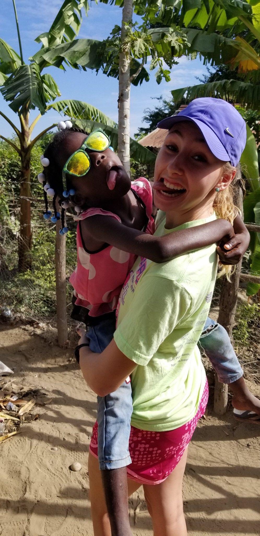 Jenna Shipman in Dominican Republic holding child